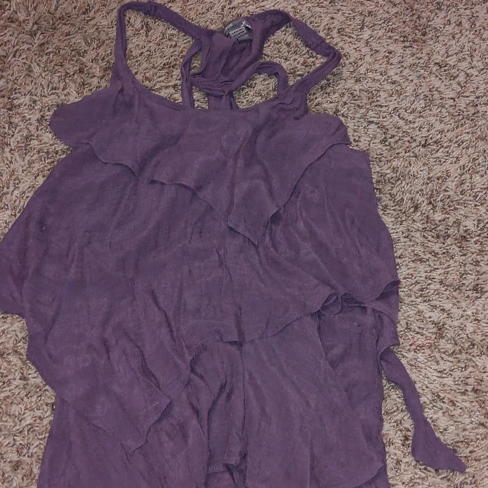 A purple tank top with ruffles